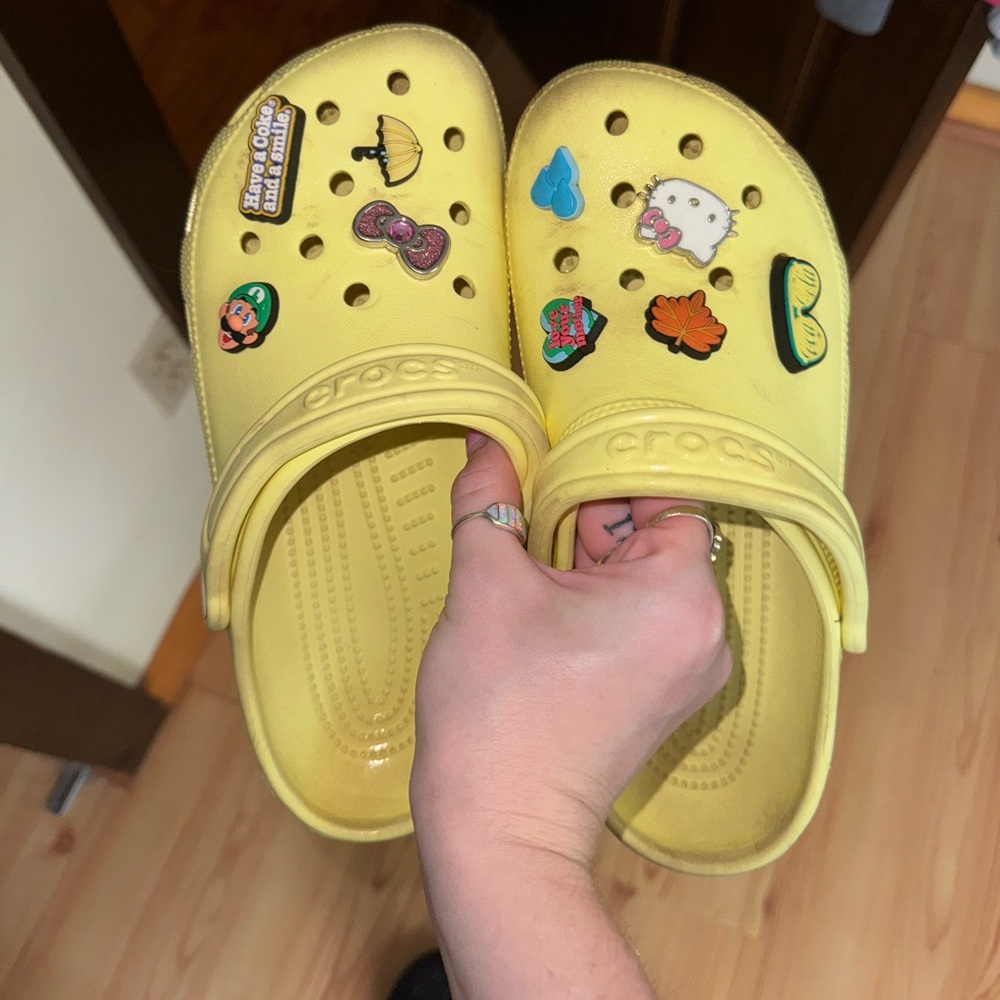 Yellow Crocs with Jibbitz size women’s 8